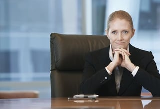 Woman CEO of a Learning Organization behind a desk